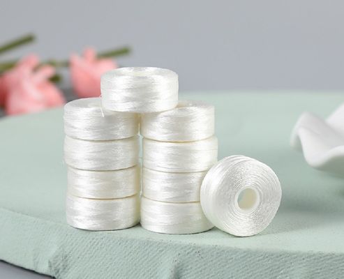 2 cm di diametro ricamo filo di fondo bianco senza confine L-tipo 75D/2 Shuttle Core cucitura prefondato bobbin 6